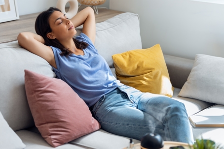 woman relaxing on couch